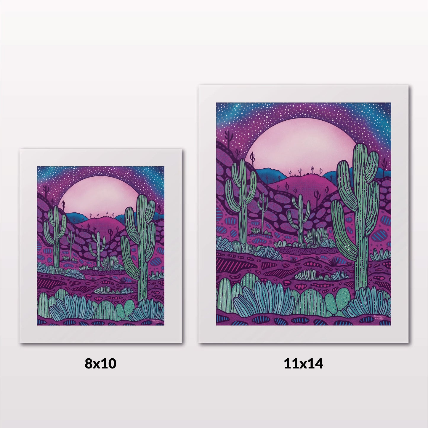 Comparing 8x10 and 11x14 framed art prints on a white wall