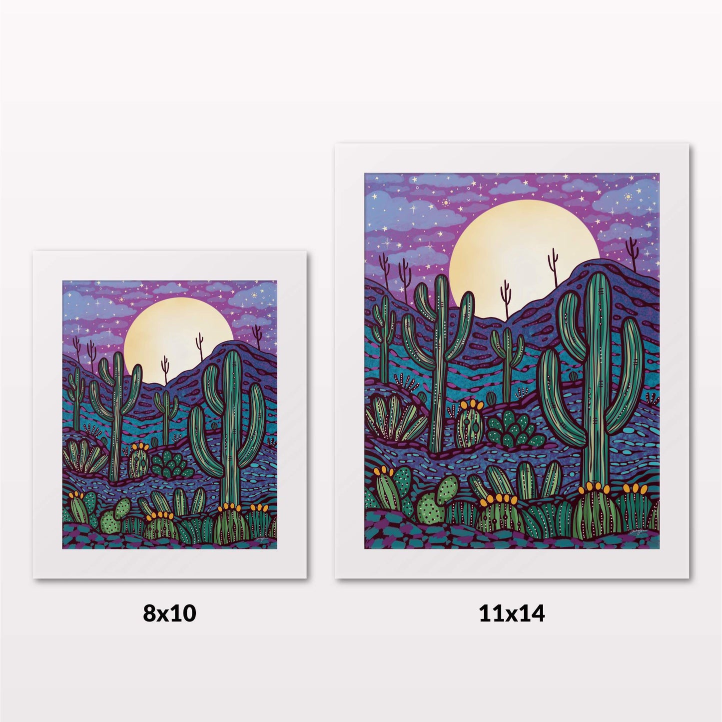 Comparing 8x10 and 11x14 framed art prints on a white wall
