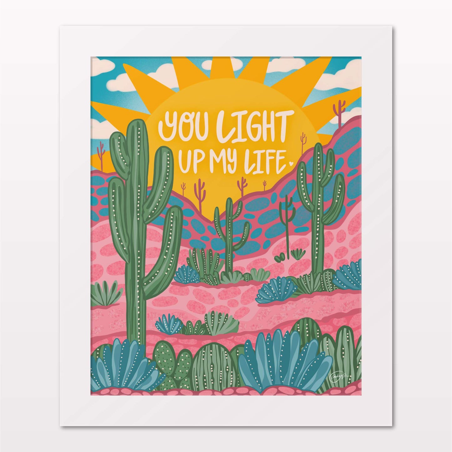 Art print in white frame on white wall