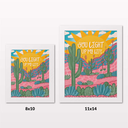 Comparing 8x10 and 11x14 framed art prints on a white wall