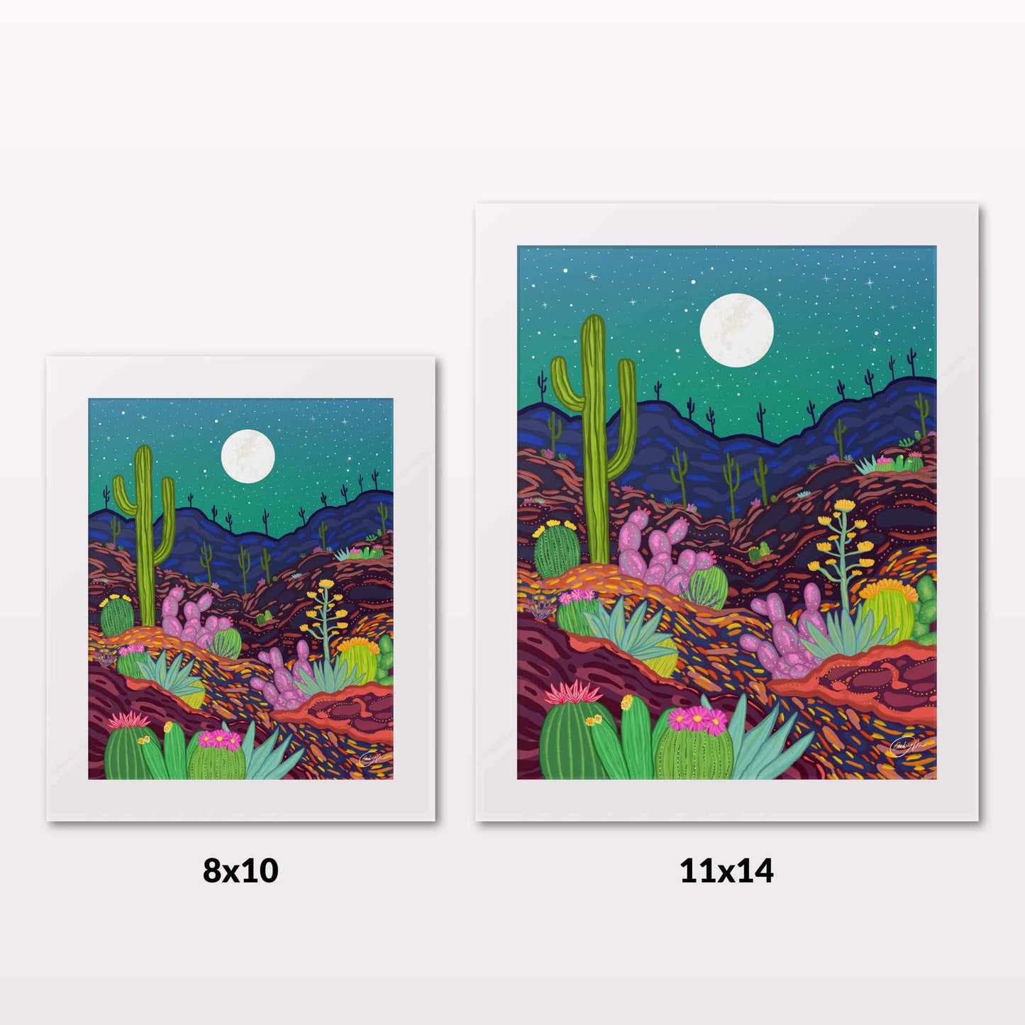 Comparing 8x10 and 11x14 framed art prints on a white wall