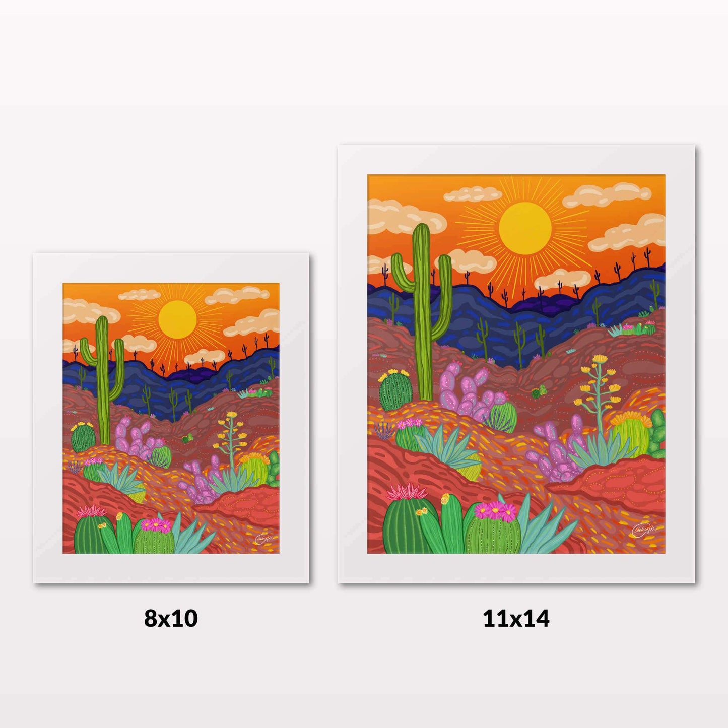 Comparing 8x10 and 11x14 framed art prints on a white wall