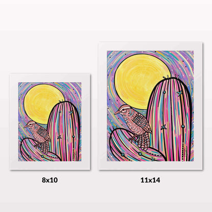 Comparing 8x10 and 11x14 framed art prints on a white wall