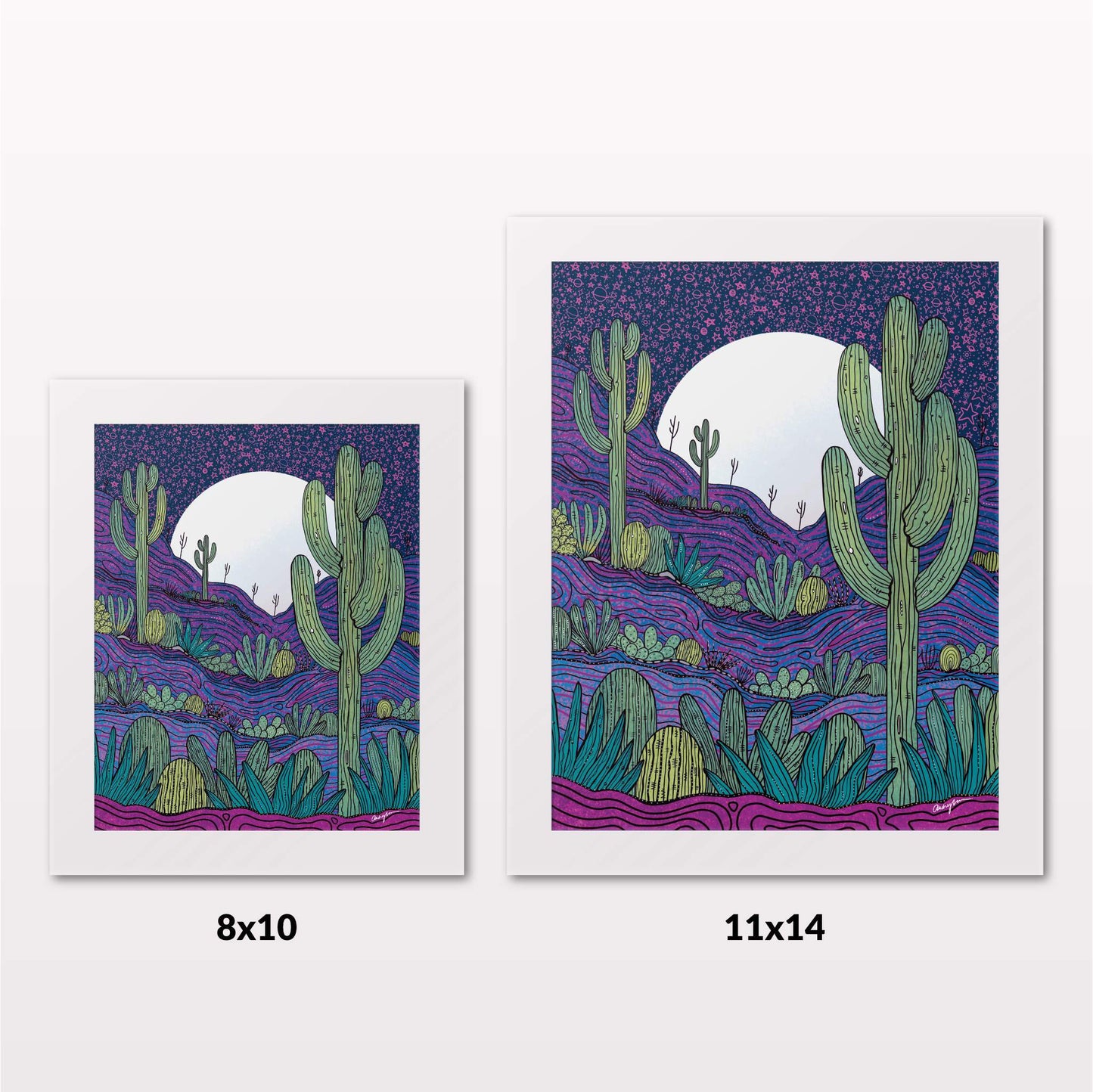 Comparing 8x10 and 11x14 framed art prints on a white wall