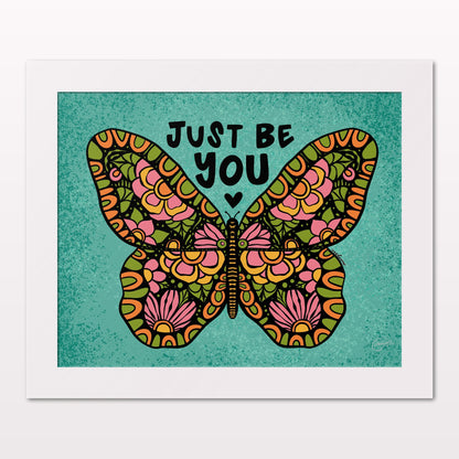 Art print in white frame on white wall