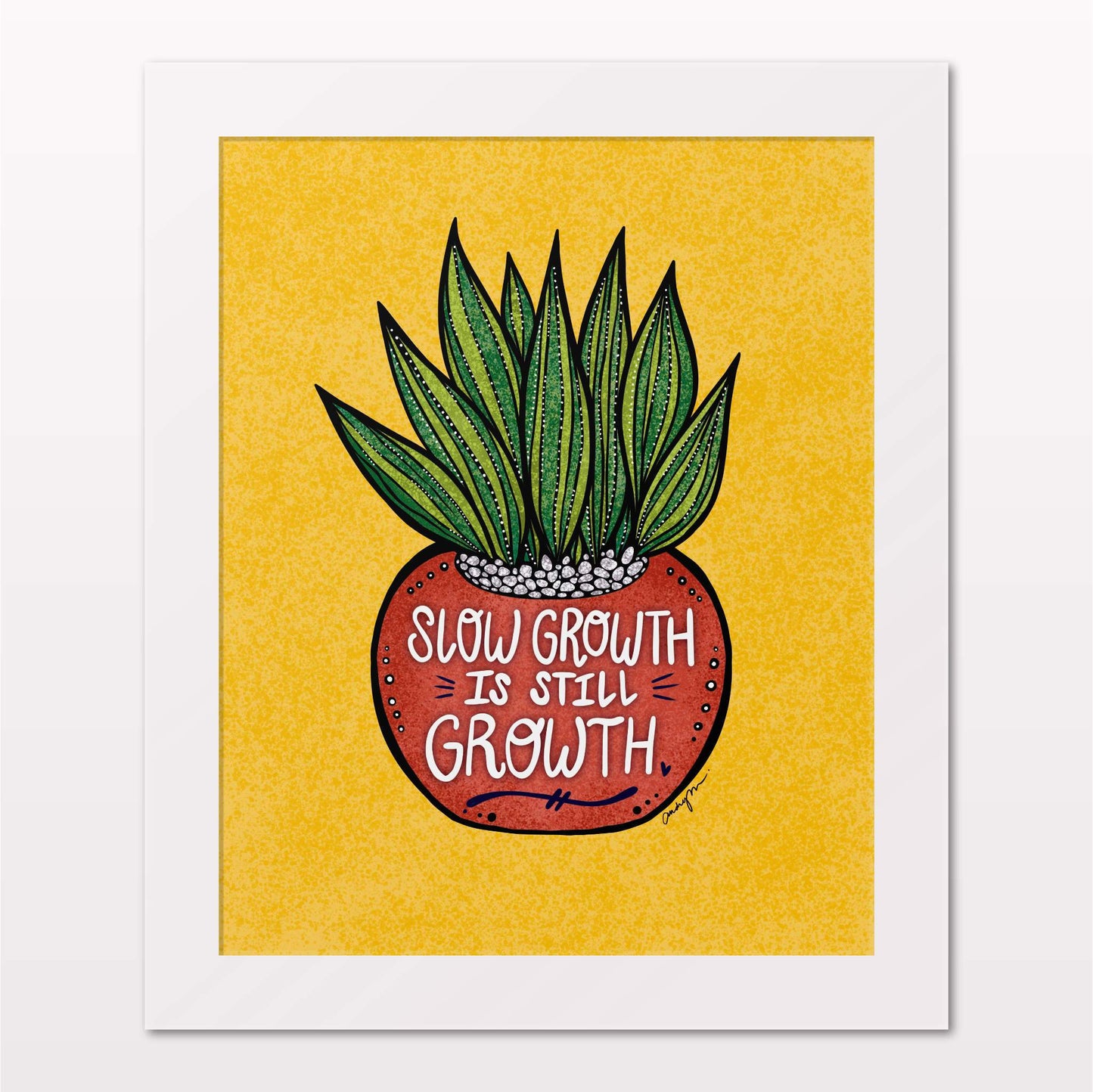 Art print in white frame on white wall