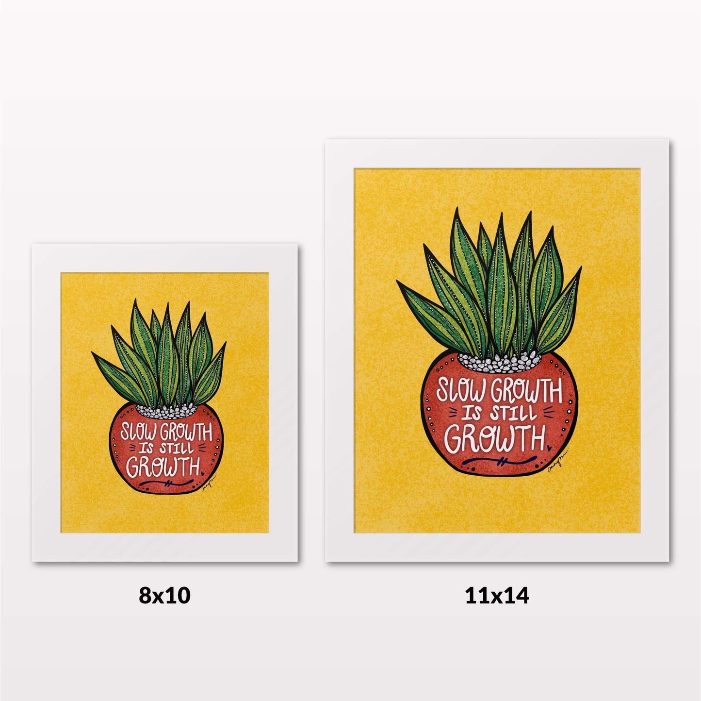 Comparing 8x10 and 11x14 framed art prints on a white wall