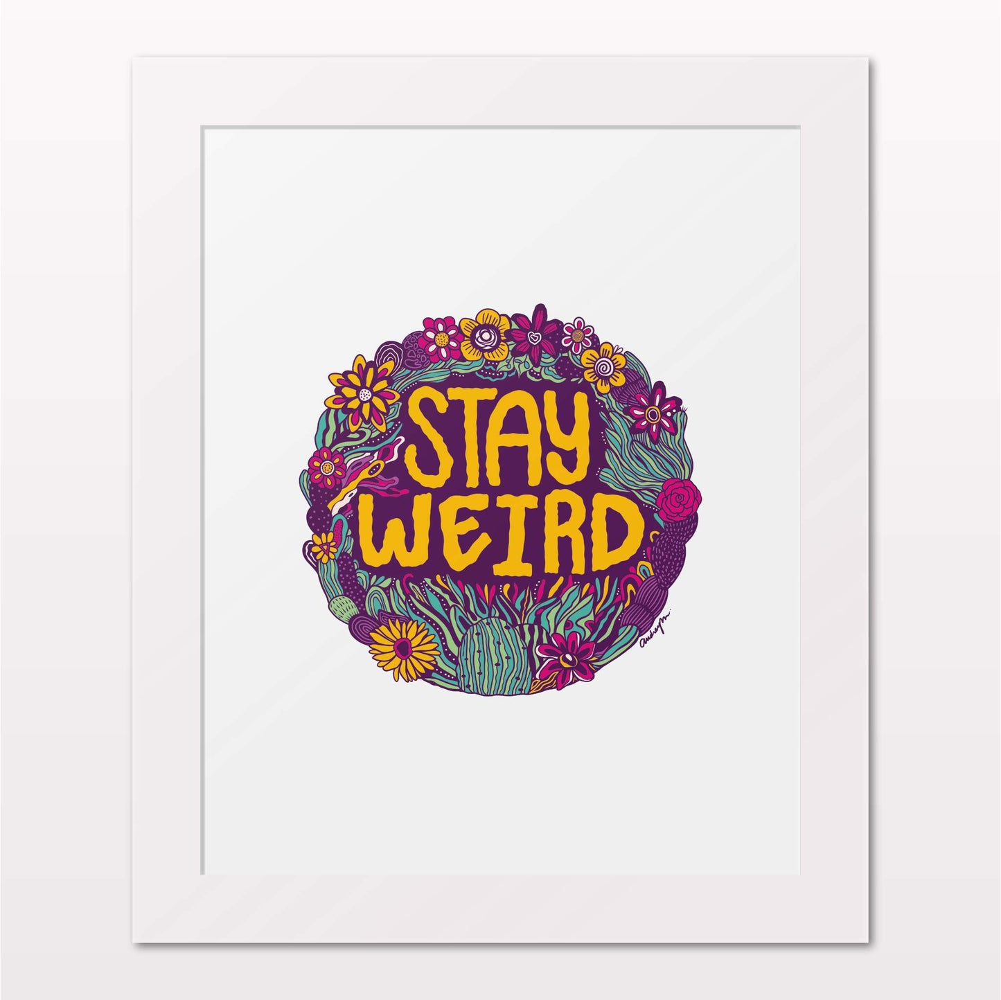 Art print in white frame on white wall