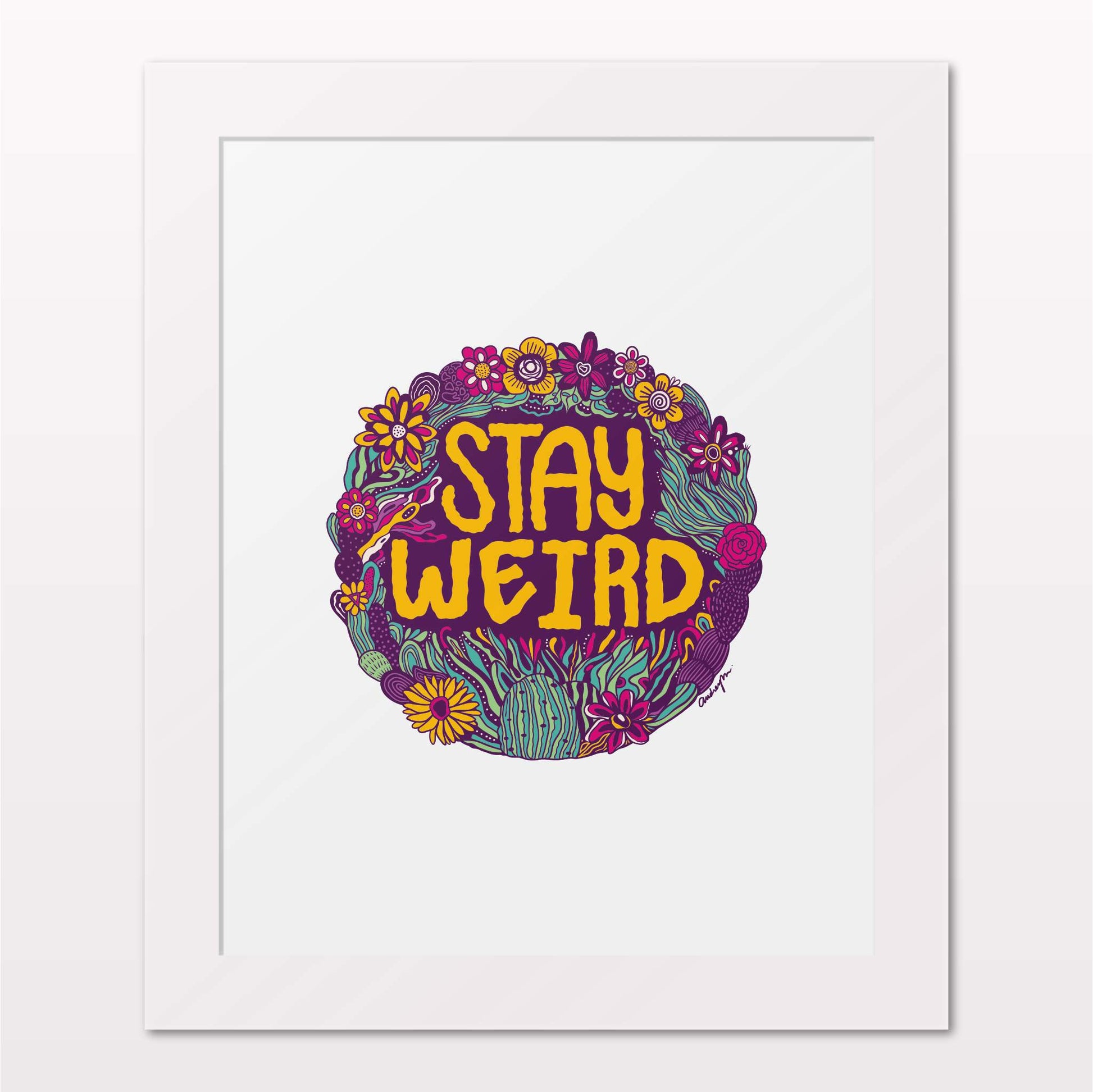 Art print in white frame on white wall