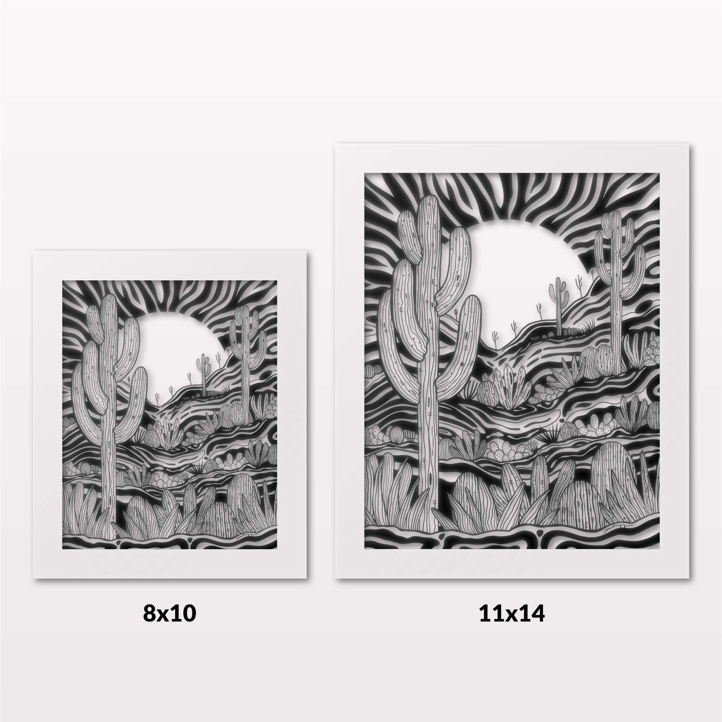 Comparing 8x10 and 11x14 framed art prints on a white wall